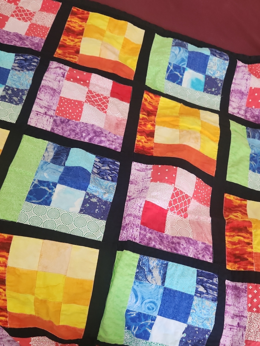 Colorful Patchwork Quilt with Black Sashing